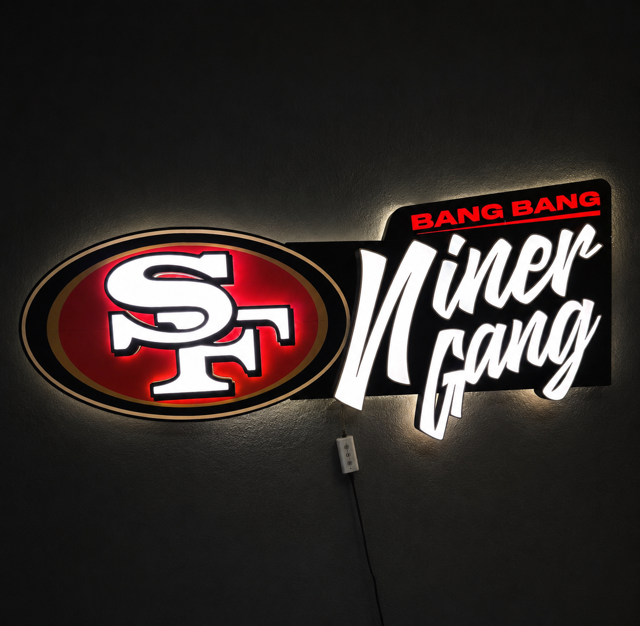 An illuminated LED neon-style wall sign featuring the San Francisco 49ers 'SF' logo in red, white, and black, alongside the words 'BANG BANG' in red and 'Niner Gang' in large white script on a black background.